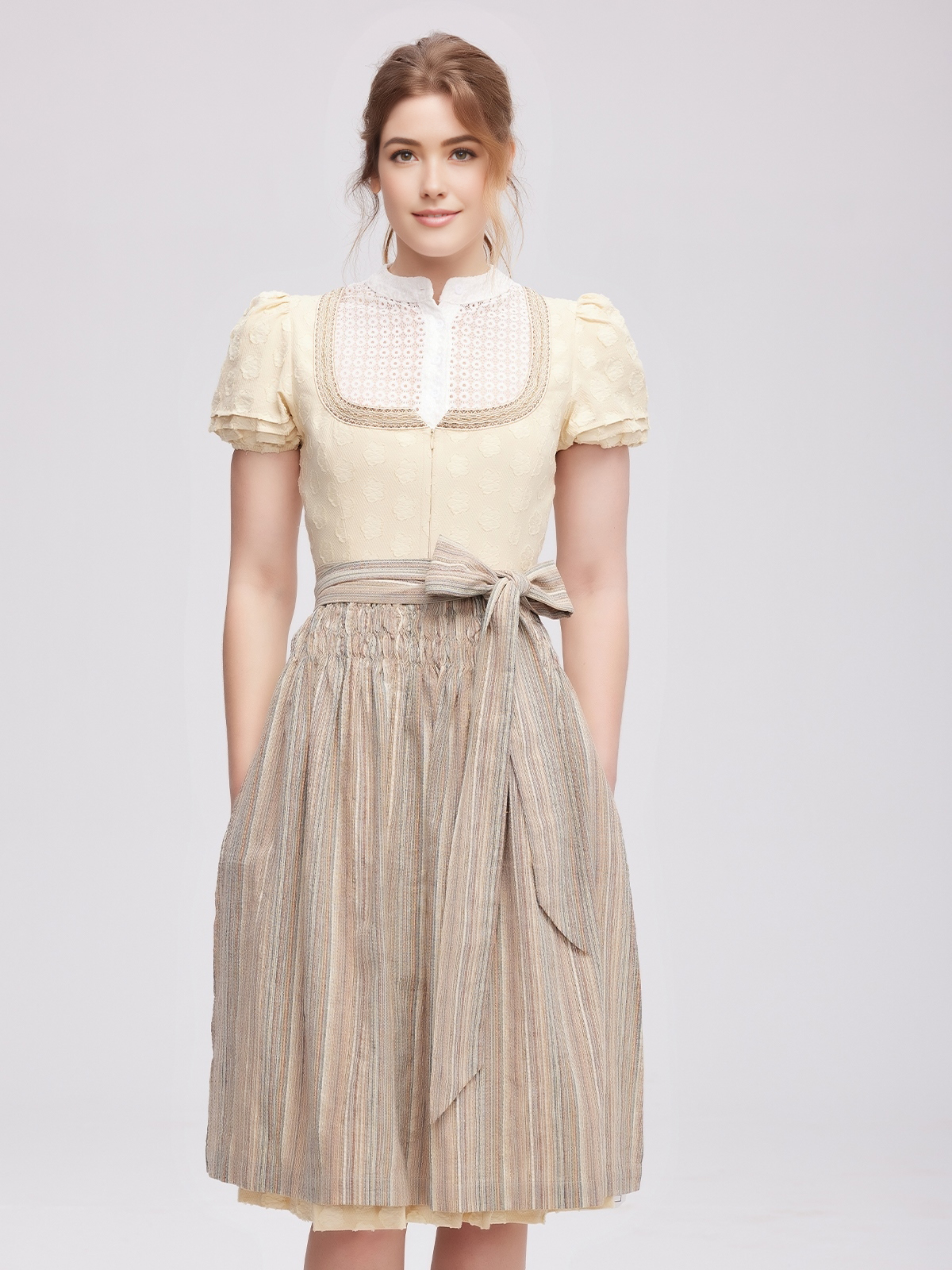 Moderne Dirndl-Kombination in Gelb